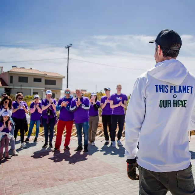 crowd of people in matching shirts