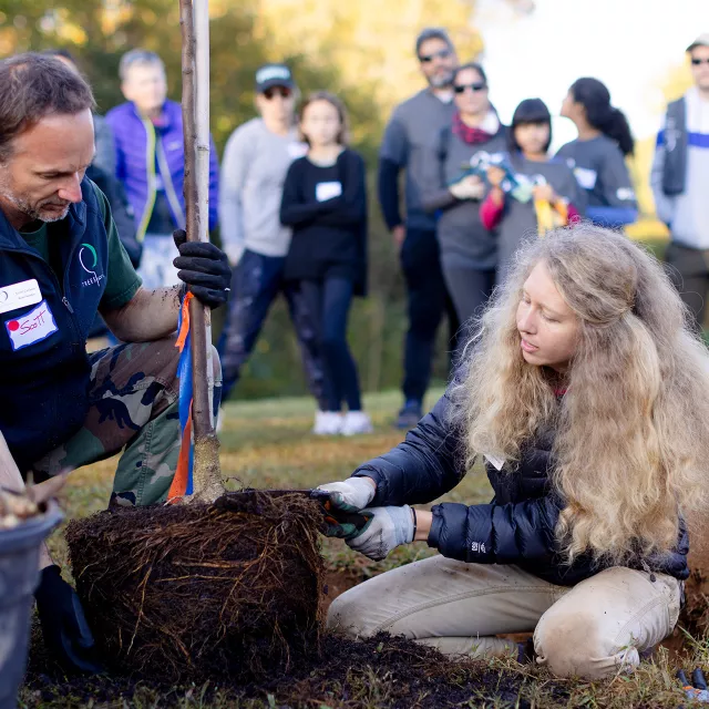 woman instructing a crowd