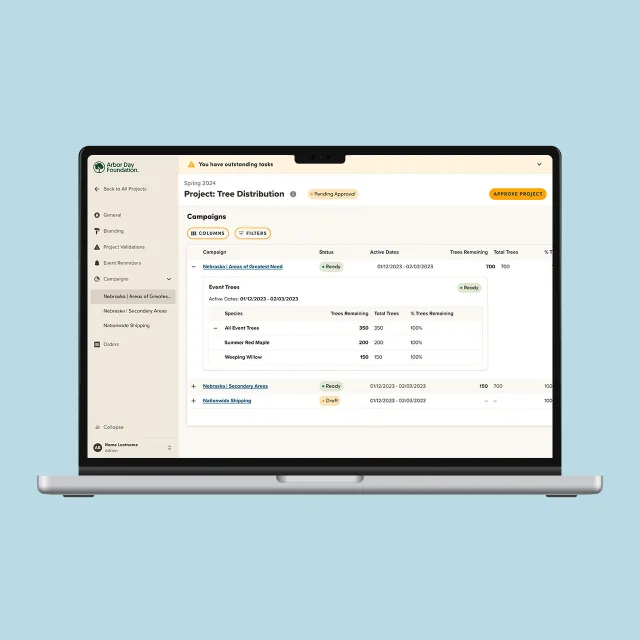 View of a laptop showing the Community Tree Distribution platform.