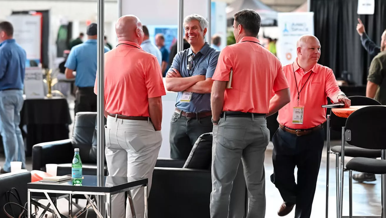 Exhibitors talking at the Trees & Utilities Conference