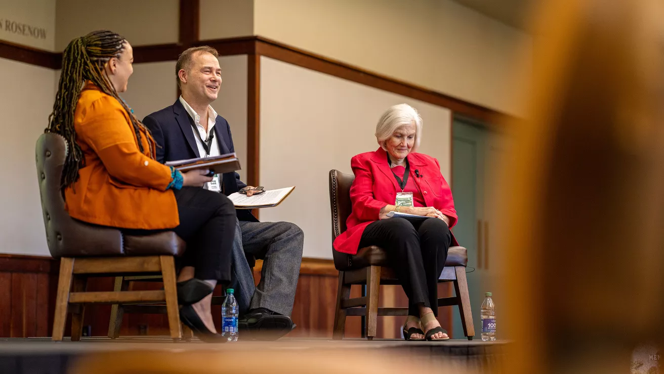 3 speakers in a panel discussion