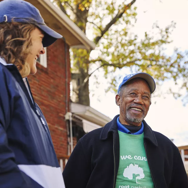 planting partner talking to a resident
