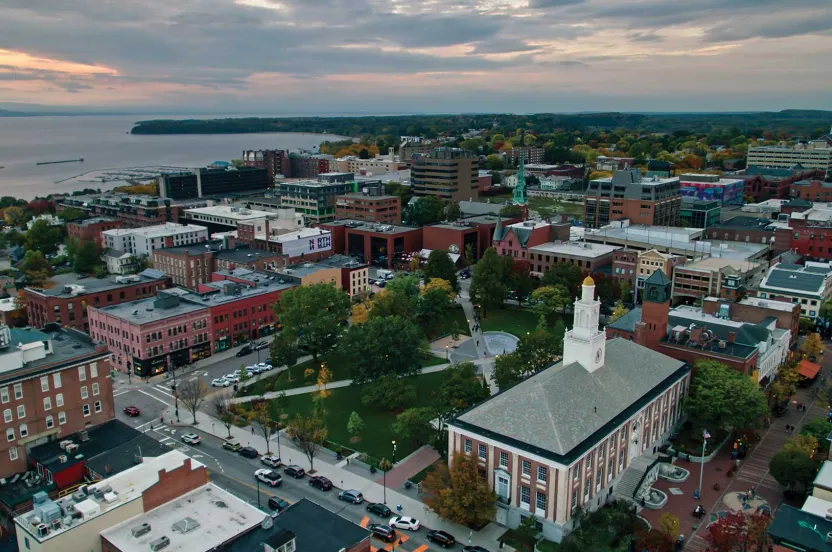 vermont cityscape with trees and ocean